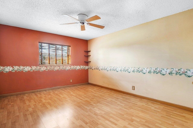 unfurnished room with wood-type flooring, a textured ceiling, and ceiling fan