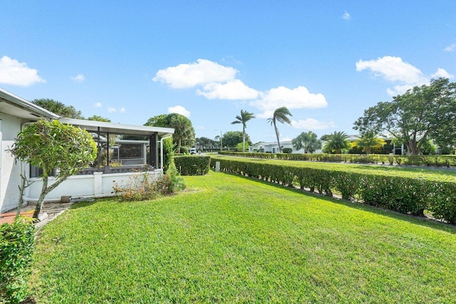 view of yard with a sunroom