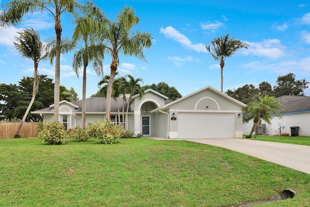 single story home with a garage and a front lawn