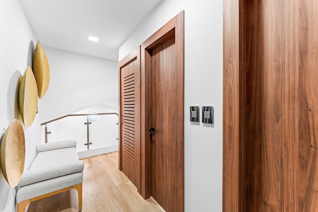 hallway with light wood-type flooring