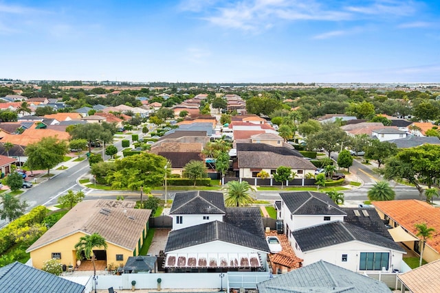 birds eye view of property with a residential view