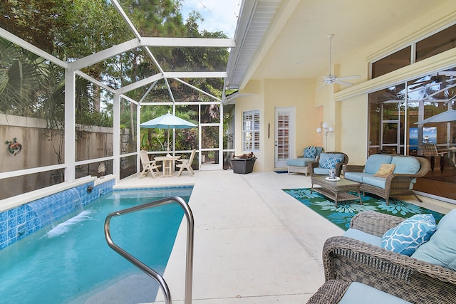 view of pool featuring an outdoor living space, a patio, a lanai, and ceiling fan