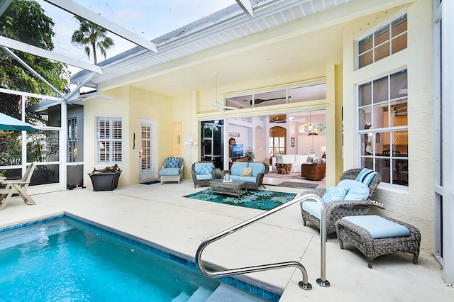 pool featuring an outdoor hangout area, a patio, and a lanai