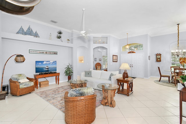 living room with light tile patterned floors, visible vents, arched walkways, crown molding, and ceiling fan with notable chandelier