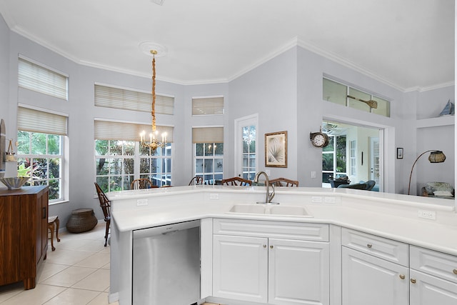 kitchen with ornamental molding, dishwasher, and a sink