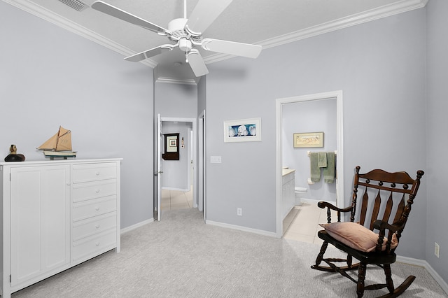 sitting room featuring ceiling fan, baseboards, light carpet, and ornamental molding