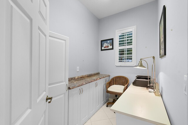 bathroom featuring tile patterned flooring and vanity