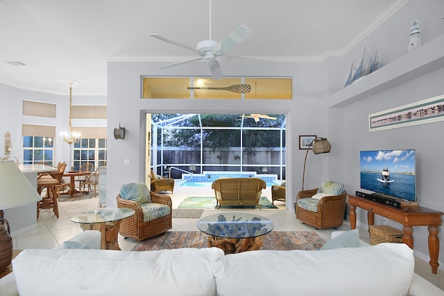 tiled living room featuring crown molding, ceiling fan with notable chandelier, baseboards, and a sunroom