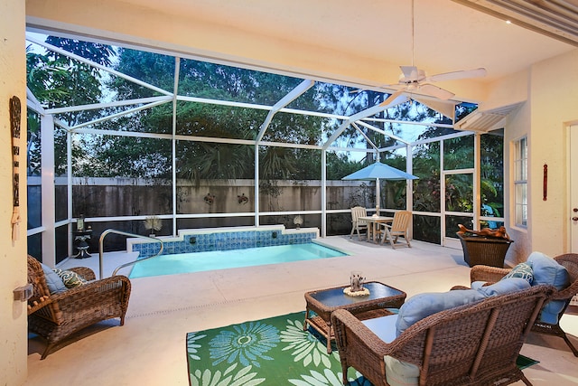 view of pool with a fenced in pool, glass enclosure, a patio, and ceiling fan