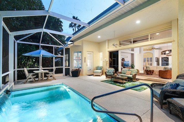 outdoor pool with a lanai, an outdoor hangout area, ceiling fan, and a patio area