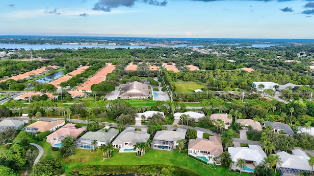 bird's eye view featuring a water view and a residential view