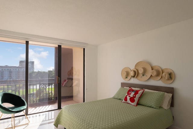 bedroom featuring access to exterior and light tile patterned flooring