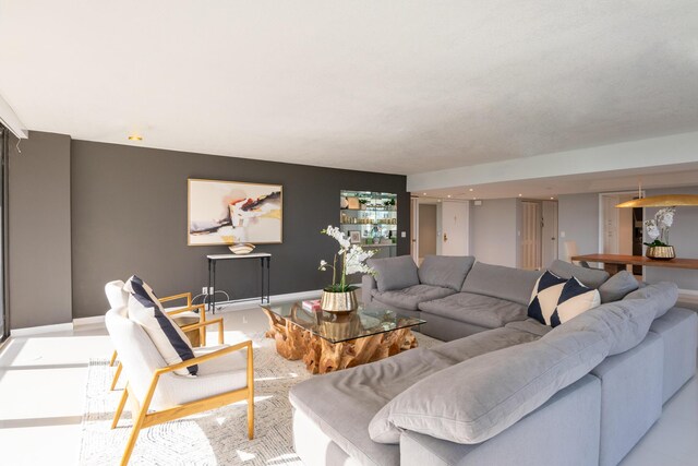 tiled living room featuring plenty of natural light