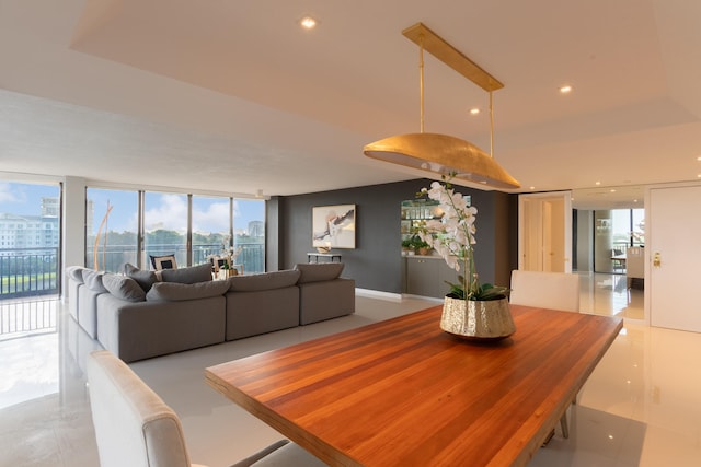 tiled dining space with expansive windows