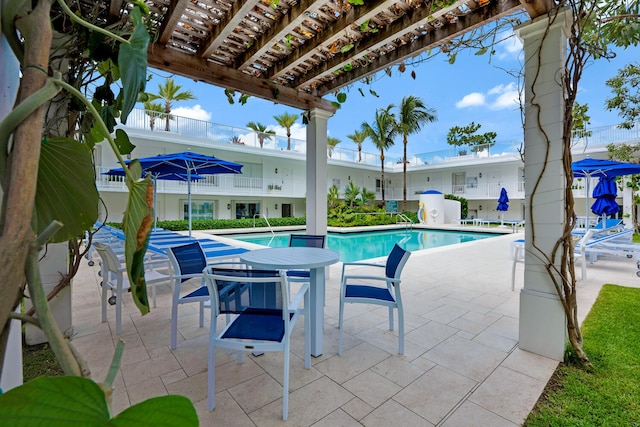 view of swimming pool with a pergola and a patio area