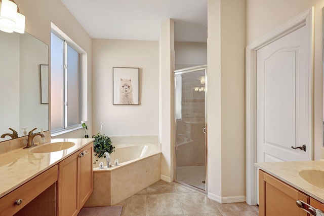 bathroom featuring tile patterned floors, vanity, and separate shower and tub