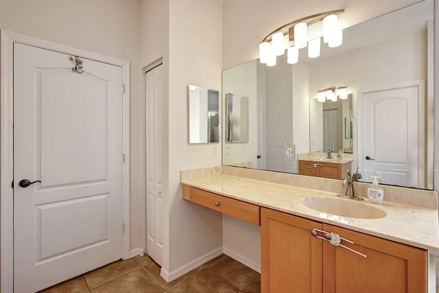 bathroom with tile patterned floors and vanity