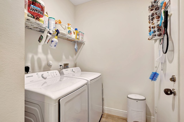 washroom featuring washer and clothes dryer