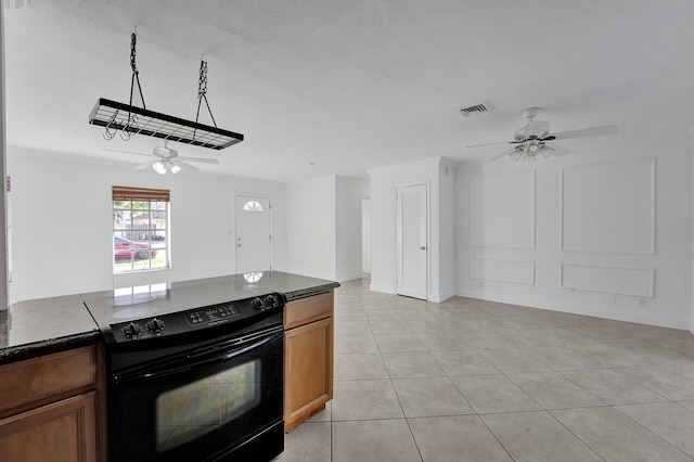 kitchen with ceiling fan, ornamental molding, light tile patterned floors, and electric range