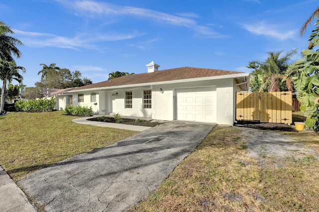 single story home with a garage and a front yard