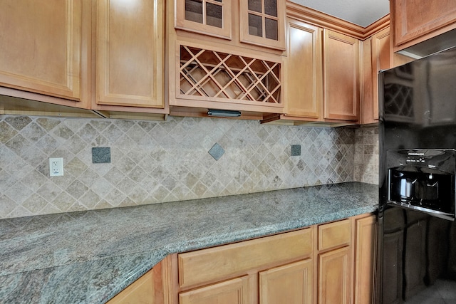 kitchen with black fridge and decorative backsplash