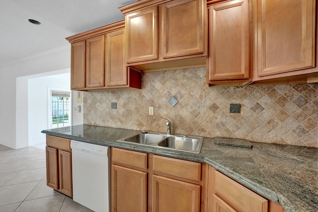 kitchen featuring ornamental molding, light tile patterned flooring, backsplash, white dishwasher, and sink