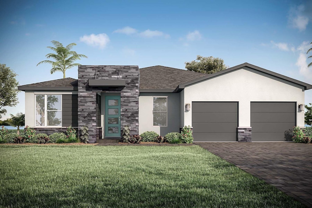 view of front of property featuring a garage and a front lawn