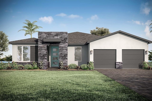 view of front of property featuring a garage and a front lawn