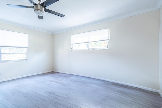 empty room featuring crown molding, dark hardwood / wood-style flooring, and ceiling fan