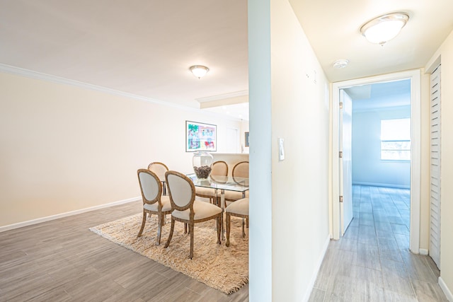 interior space with ornamental molding and light wood-type flooring