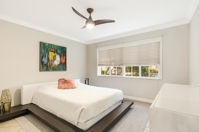 tiled bedroom with ceiling fan and crown molding