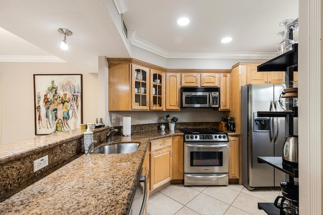 kitchen featuring stainless steel appliances, sink, light tile patterned flooring, crown molding, and dark stone countertops