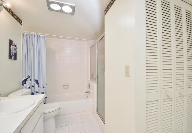 bathroom featuring toilet, vanity, and tile patterned floors