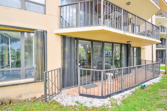 entrance to property with a balcony