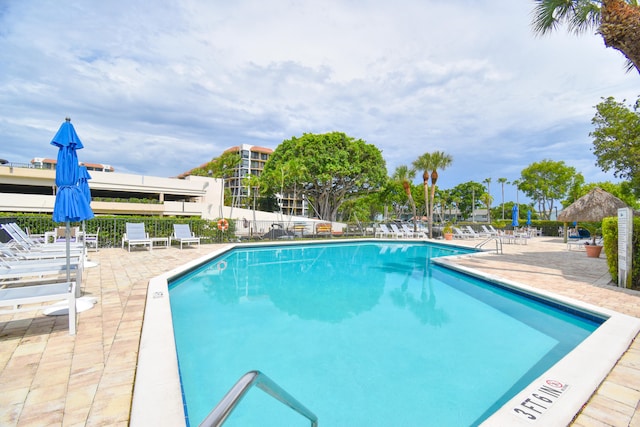 view of swimming pool with a patio