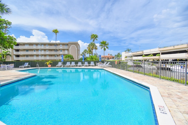 view of swimming pool with a water view