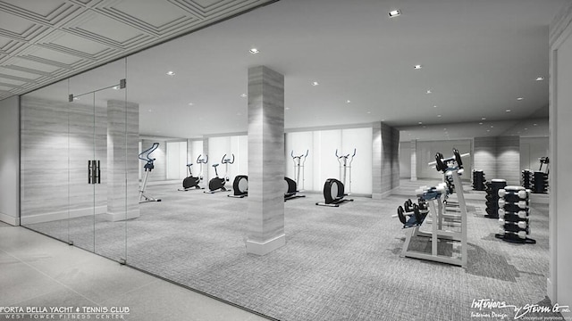 exercise room with ornate columns and light colored carpet