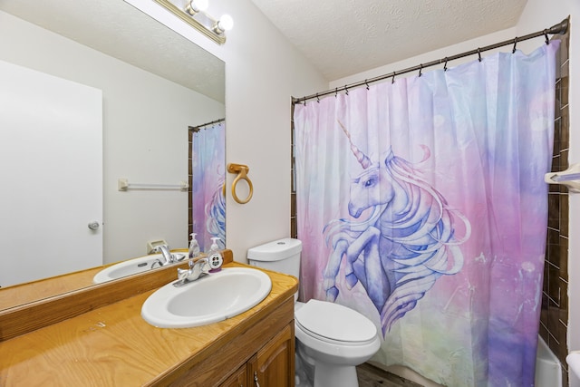 full bathroom with toilet, shower / bath combo, vanity, and a textured ceiling