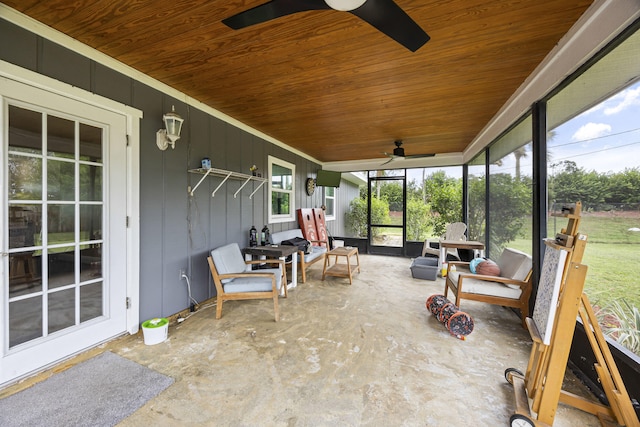 sunroom / solarium featuring ceiling fan and wood ceiling