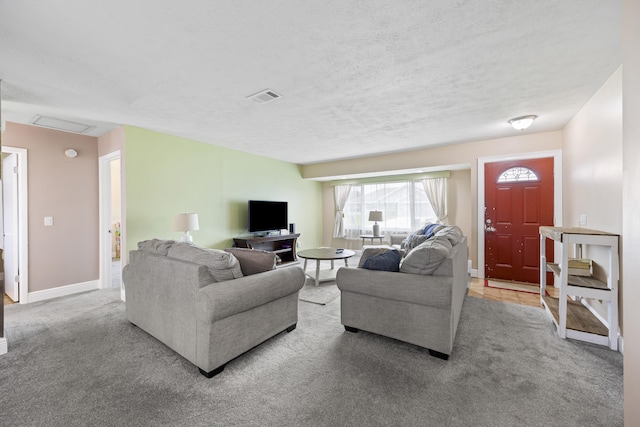 living room featuring a textured ceiling and light carpet