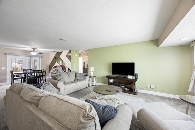 living room featuring ceiling fan and light carpet