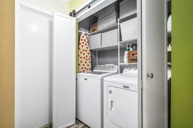 washroom featuring independent washer and dryer and hardwood / wood-style flooring