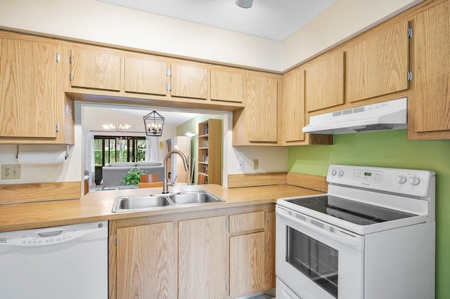 kitchen with a chandelier, a textured ceiling, sink, and white appliances