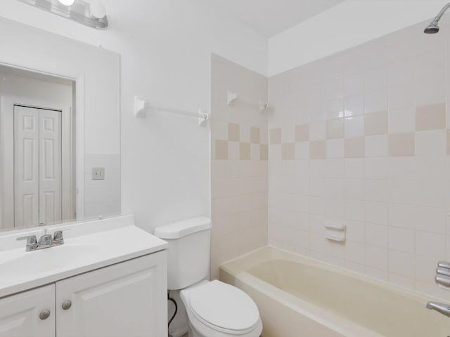 full bath featuring toilet, vanity, and  shower combination