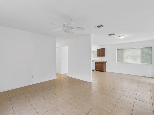 unfurnished room featuring ceiling fan and light tile patterned flooring