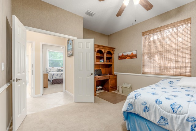 carpeted bedroom featuring ceiling fan and vaulted ceiling