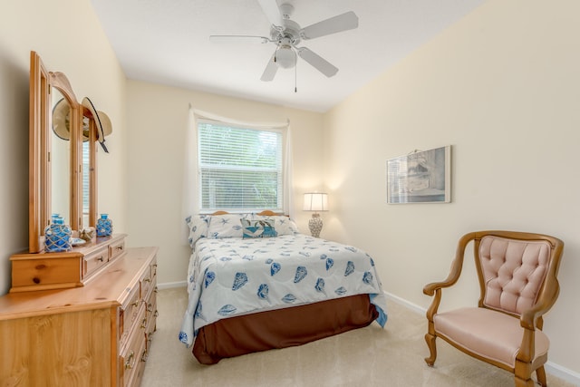 bedroom with light colored carpet and ceiling fan