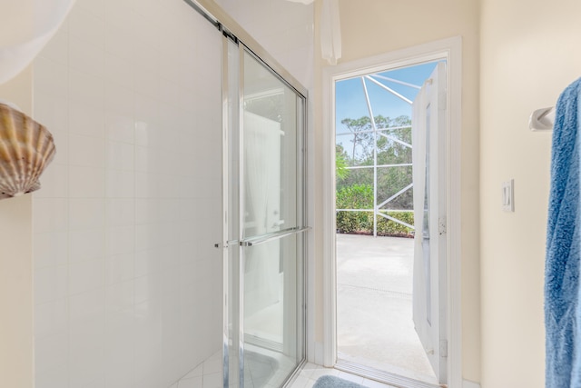 interior space featuring a shower with door