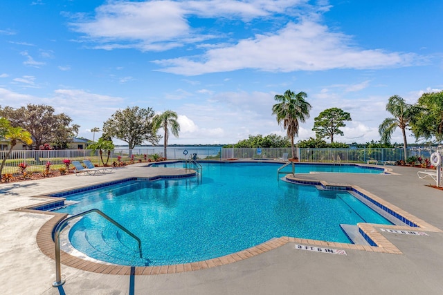 view of swimming pool with a patio area