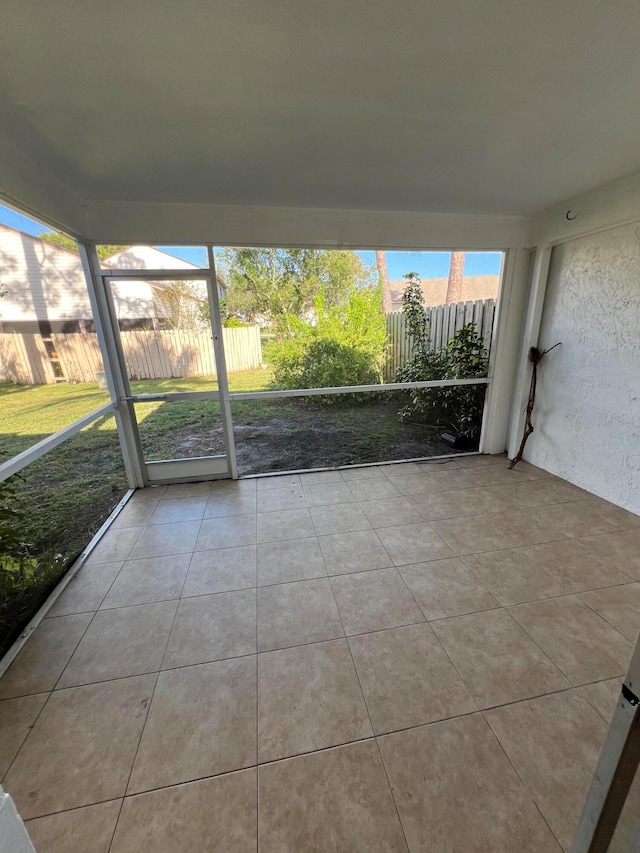 unfurnished sunroom with a healthy amount of sunlight